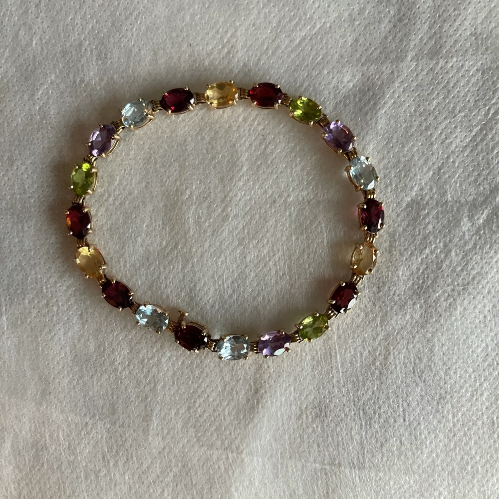 14k gold multi gem stone tennis bracelet.
